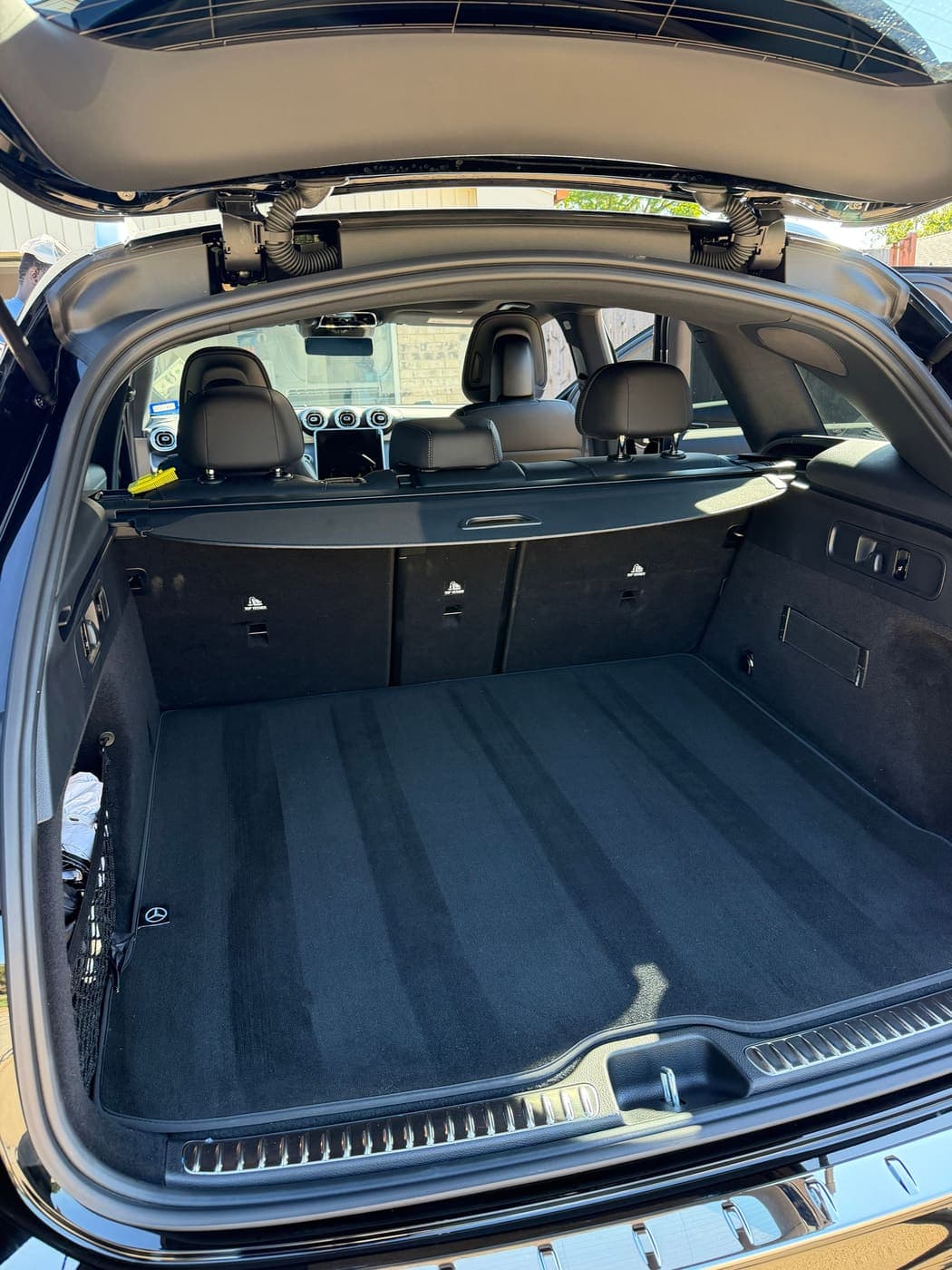Vacuumed Mercedes-Benz SUV cargo area with fresh carpet lines