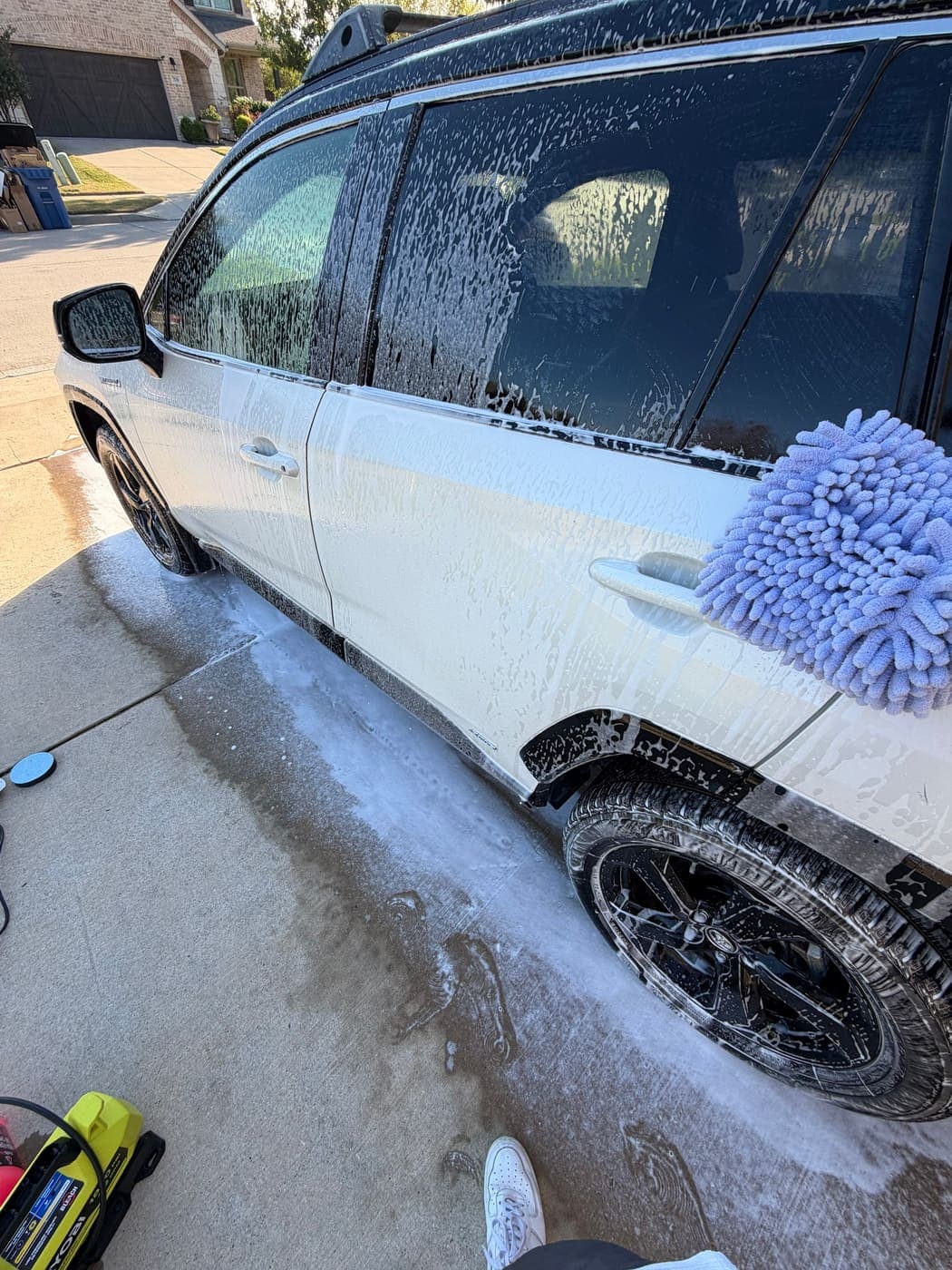Toyota RAV4 covered in foam during a hand wash with a wash mitt