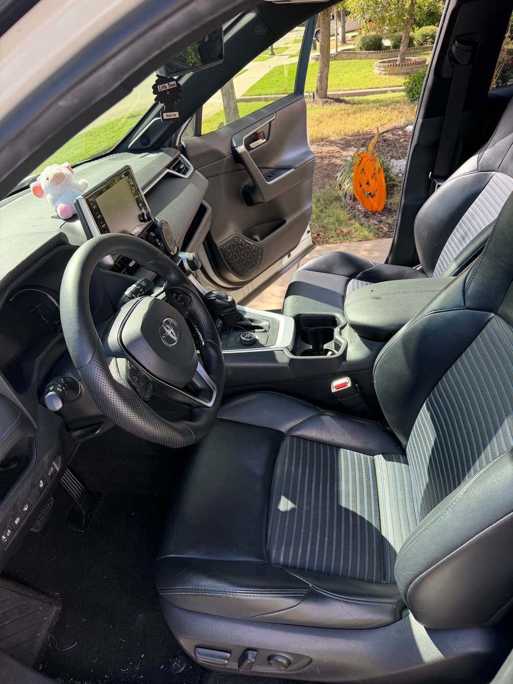 Toyota RAV4 front interior with clean seats and dashboard